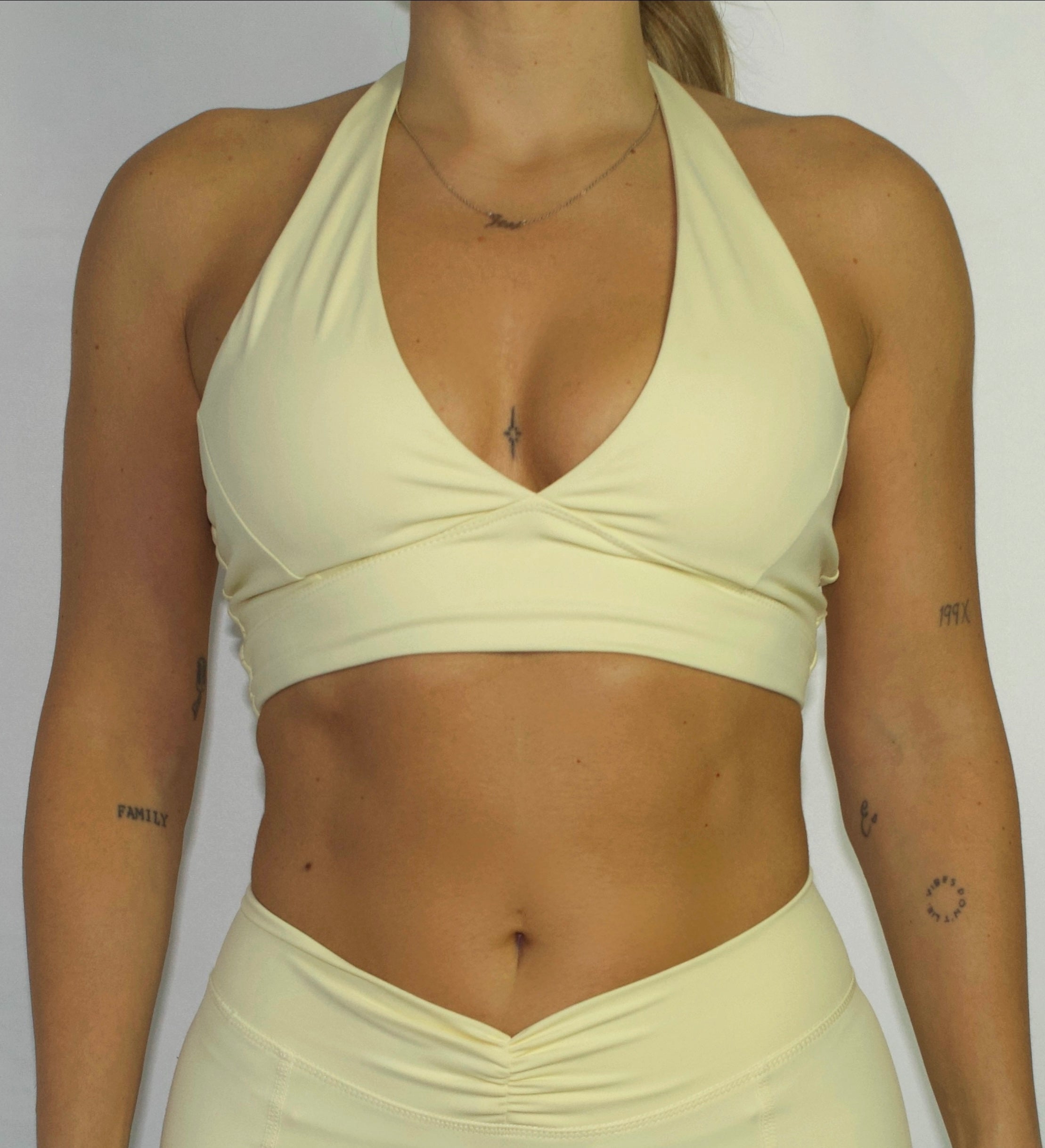 SoftEra™ - Halter sports bra in Butter Yellow
